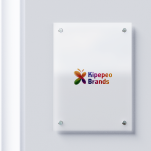 Modern Perspex signage with Kipepeo Brands logo on a sleek acrylic plaque mounted on a white wall.